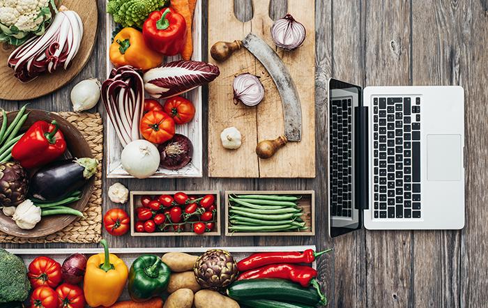 Adobe Stock - Laptop surrounded by fruits and vegetables