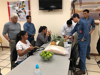 Negotiations with local farmers to substitute the company's catering contractor with local goods - substituted 100% of the rice and 70% of the fruit, e.g., papayas, pineapples.