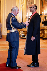 Prof Yadvinder Malhi receiving a CBE from the Prince of Wales