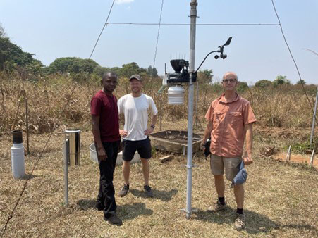 Automatic weather station installation at Mwinilunga: Left to right: Enock, Callum, Sebastian