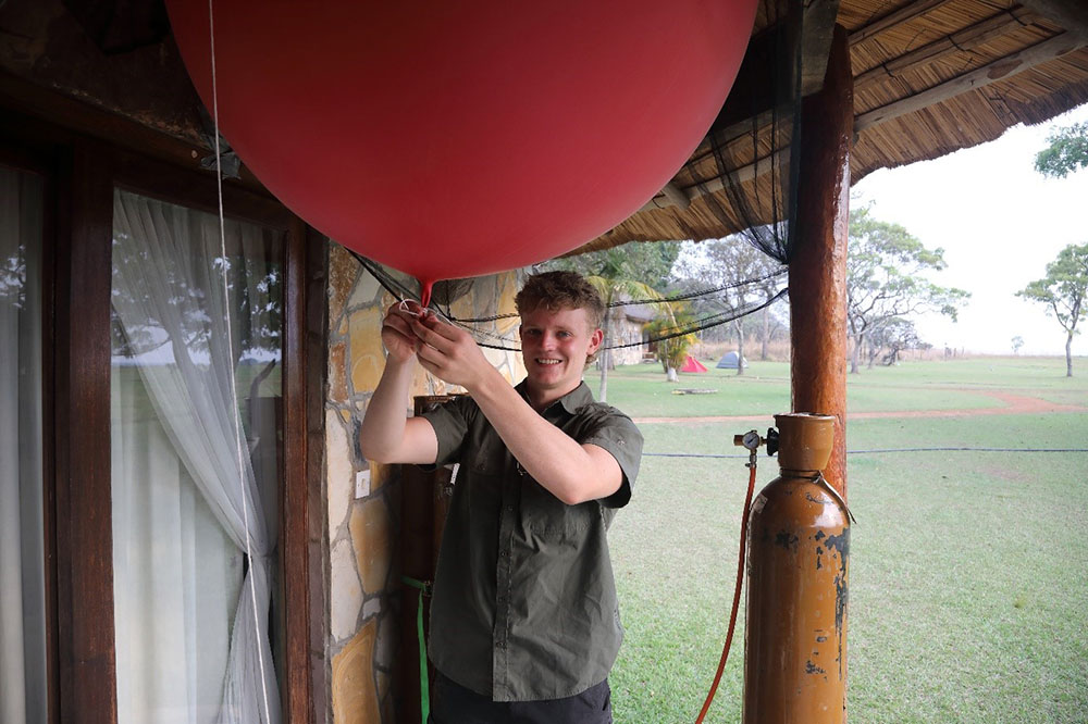 Second Year SoGE undergraduate, Chris Edmunds, recipient of RGS award, prepares a weather balloon