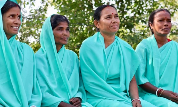 Four women sitting in a row