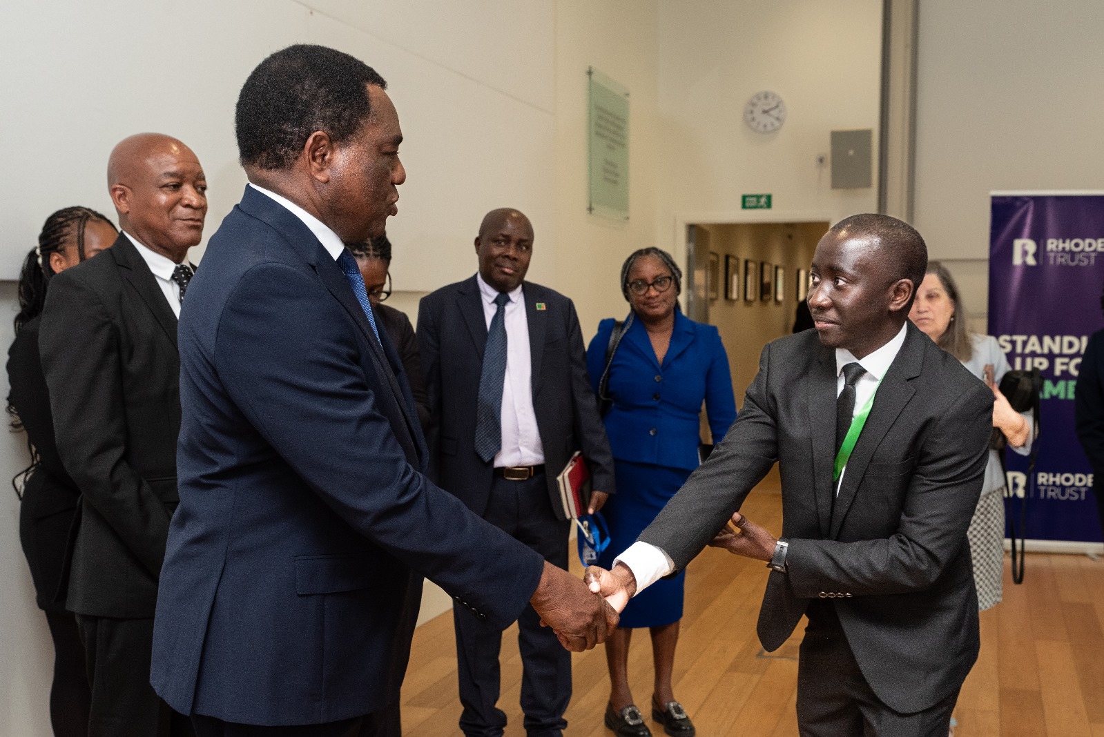 Lubasi Limweta shaking hands with President Hichilema