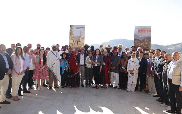 Group photo of Mobile Peoples delegates and participants with HRH Princess Basma bint Talal.