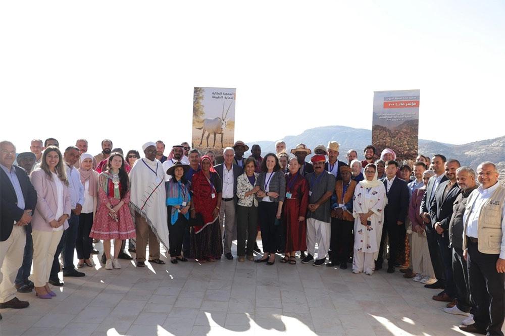 Group photo of Mobile Peoples delegates and participants with HRH Princess Basma bint Talal.