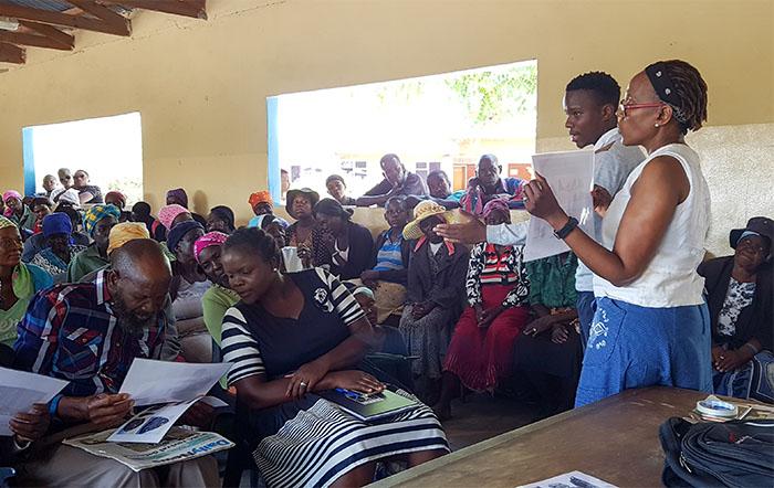 Dr Sarah Mothulatshipi and Topo Mpho Çhengeta in Gweta, Botswana exchanging knowledge with the local community about long term environmental change and stone age archaeology in the area. Sallie Burrough, Author provided