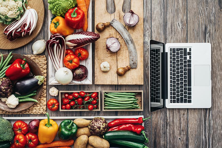Adobe Stock - Laptop surrounded by fruits and vegetables