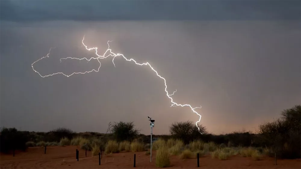 Lightning strikes behind the automatic weather station just south of Kgalagadi Transfrontier Park.