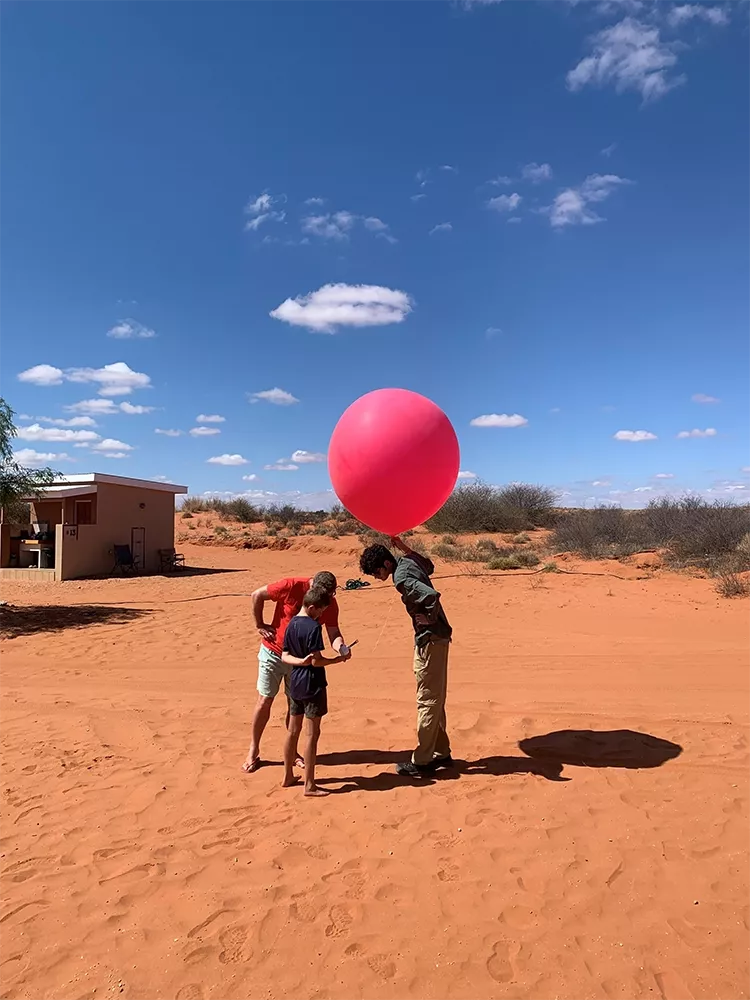 Second year undergraduate, Eoin Ware, gets some help with the weather balloon release.