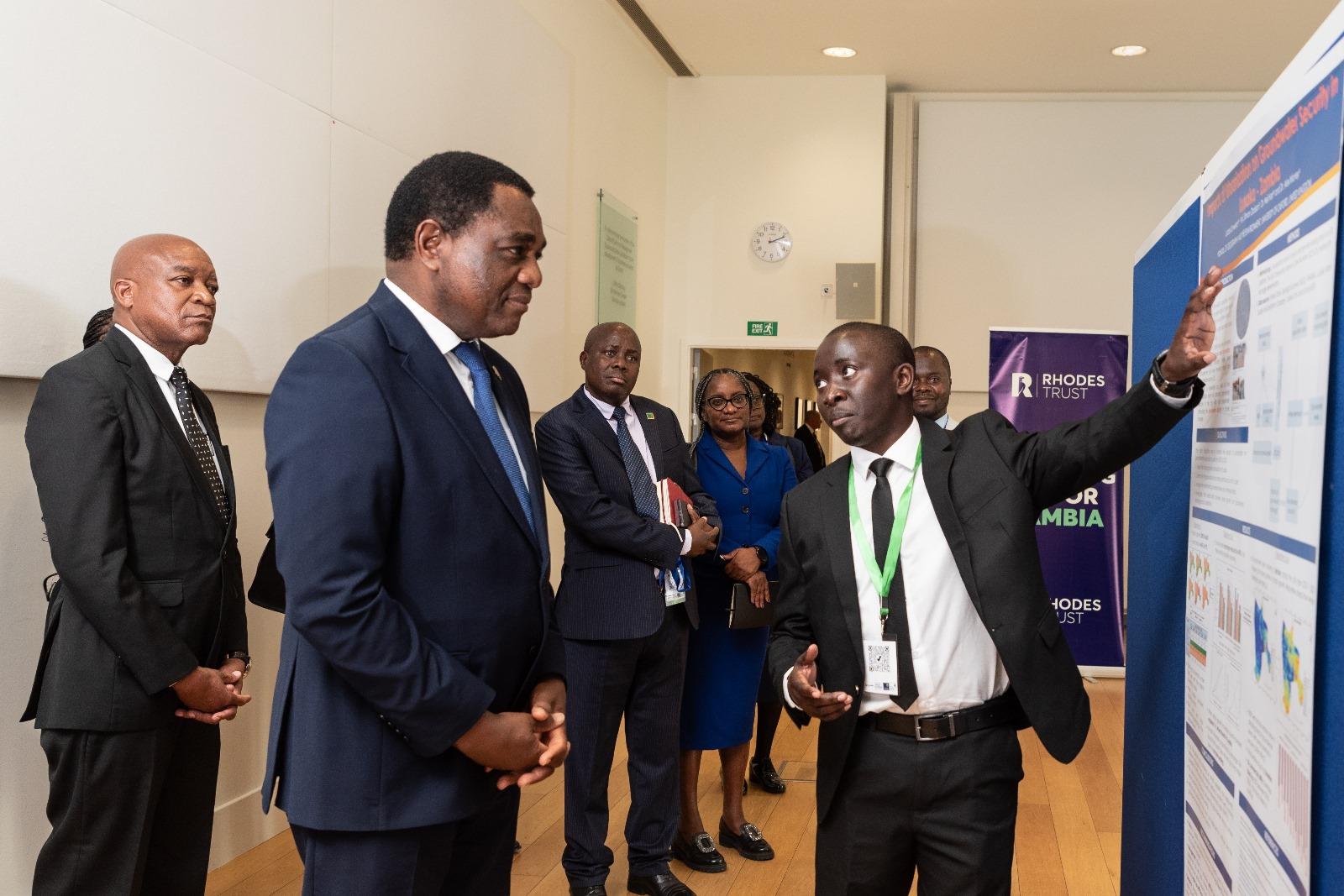 Lubasi Limweta presents his dissertation research to the President of Zambia.