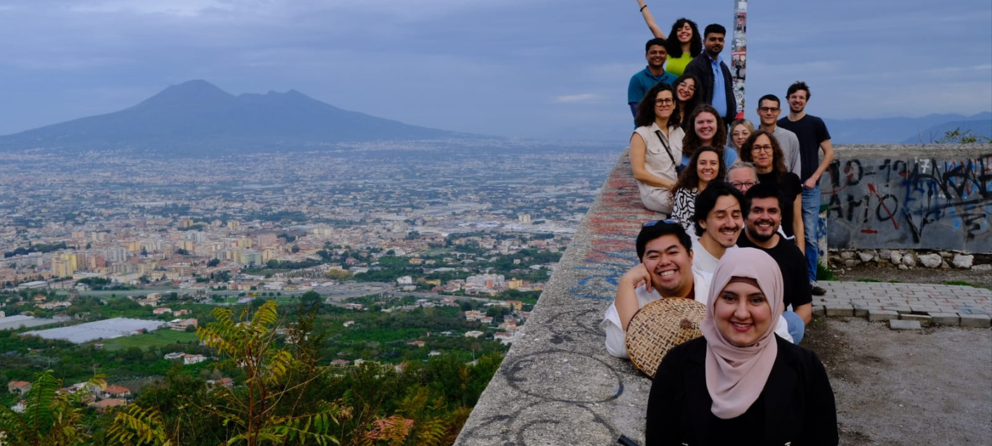Pompeii and people smiling at camera