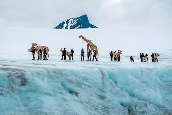The Herds performers traverse an icy landscape in northern Norway