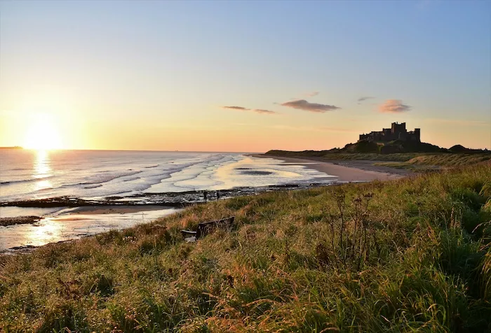 Sunrise over the beach at Bamburgh Castle in Northumberland