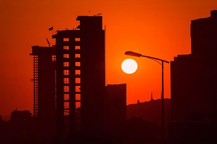 Setting sun behind Istanbul tower block