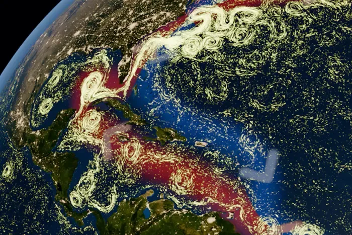 Atlantic surface currents and eddies, with arrows showing the Amoc’s warm northward surface flow and cold southward return flow at depth.) Brenden Jongman / NASA and NOAA data / Amoc pathways added schematically. via The Conversation.